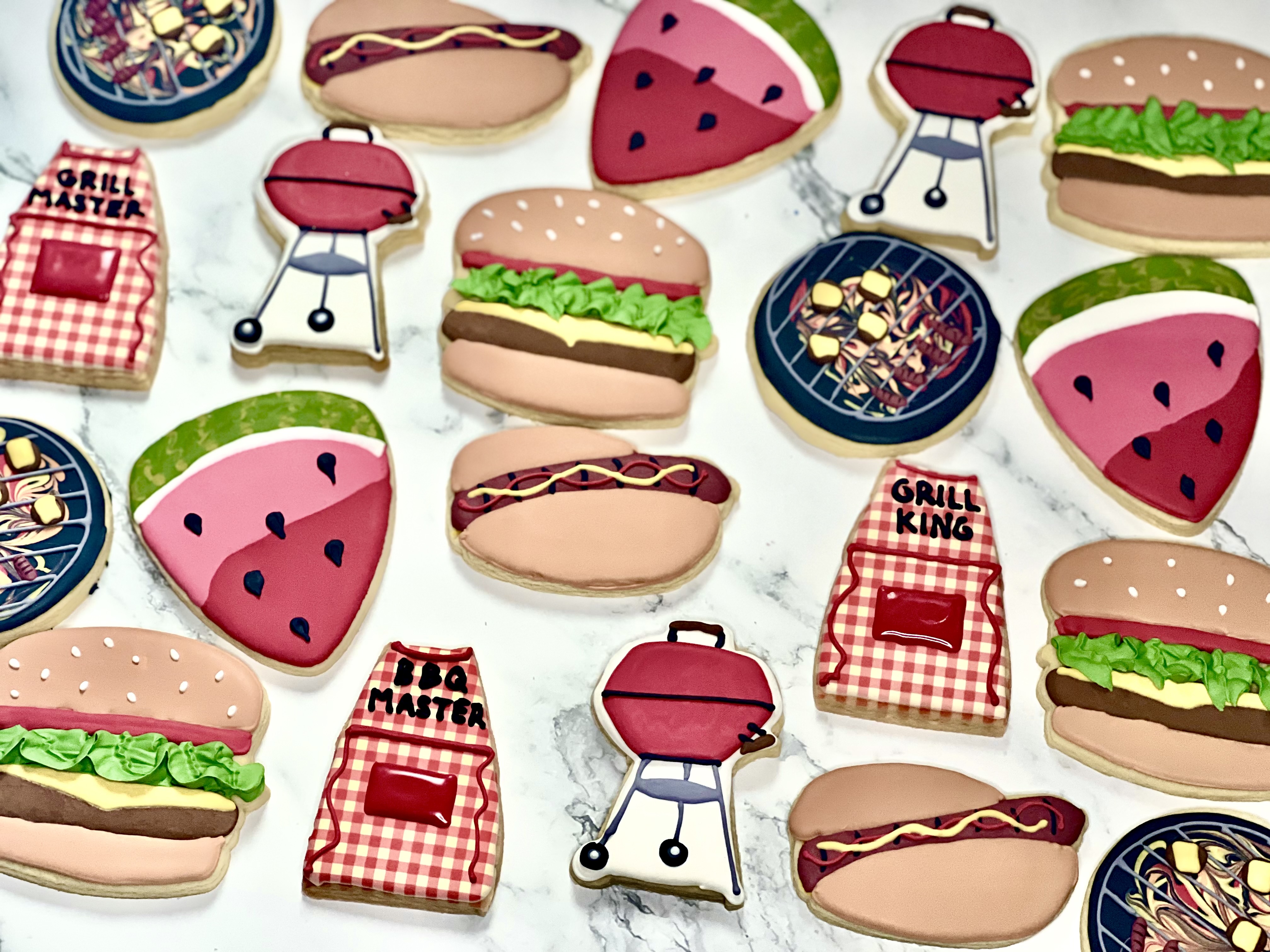BBQ-themed cookies with grills, burgers, hot dogs, and watermelon